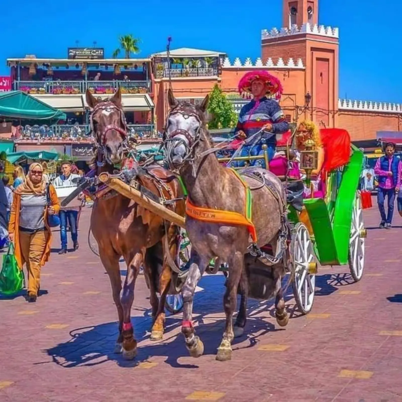 Carriage passing the Koutoubia Mosque and Medina walls